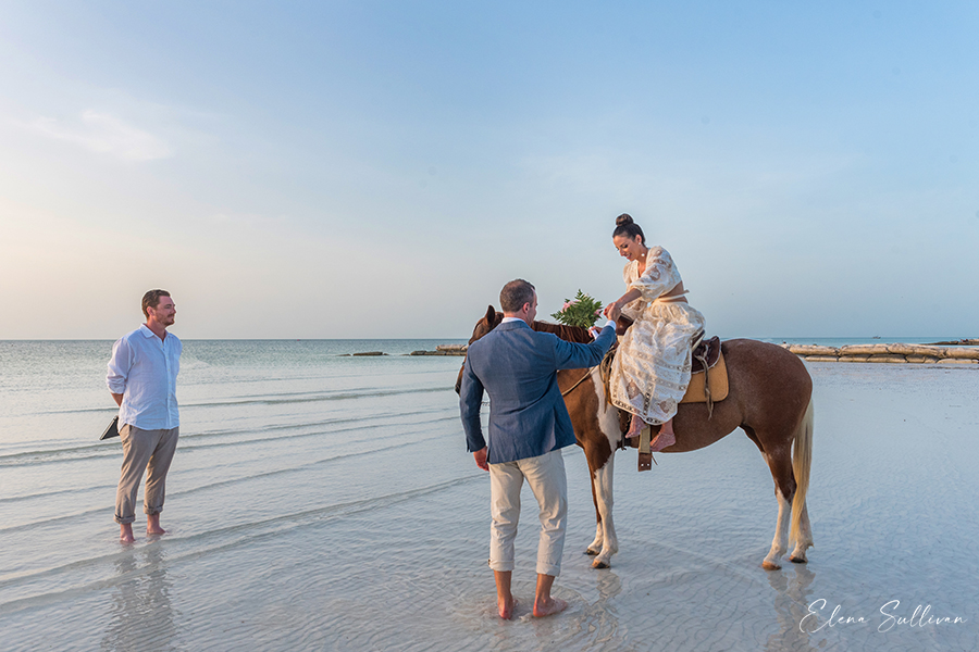 bride riding horse beach wedding Holbox