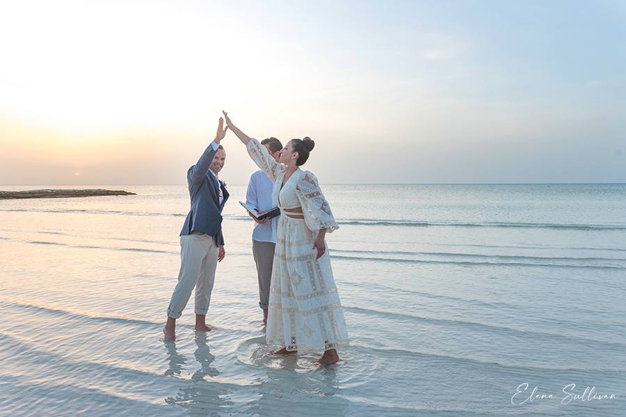 couple in water beach wedding
