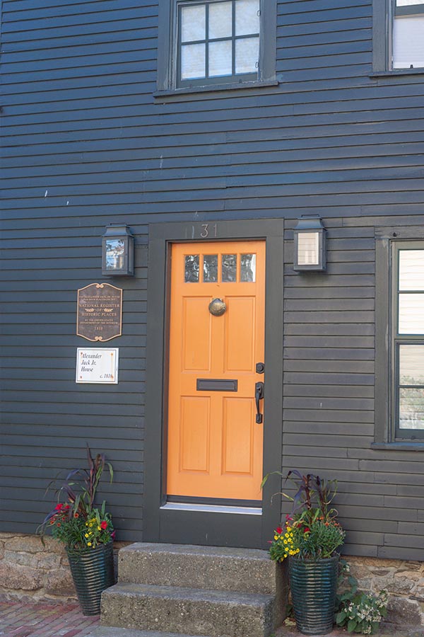 black-facade-orange-door