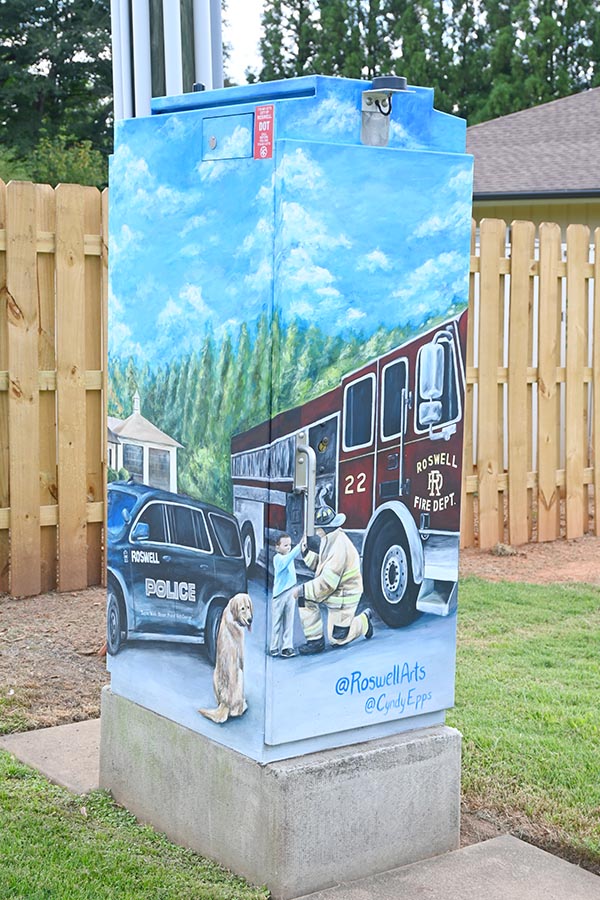 fireman-paiting-on-utility-box-roswell-art