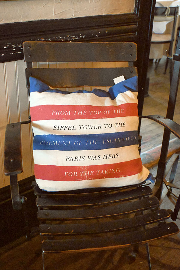 decorative-square-pillow-with-red-white-and-blue-stripes-and-the-text-FROM-THE-TOP-OF-THE-EIFFEL-TOWER-TO-THE-BASEMENT-OF-THE-ESCAR-GO-GO-PARIS-WAS-HERS-FOR-THE-TAKING