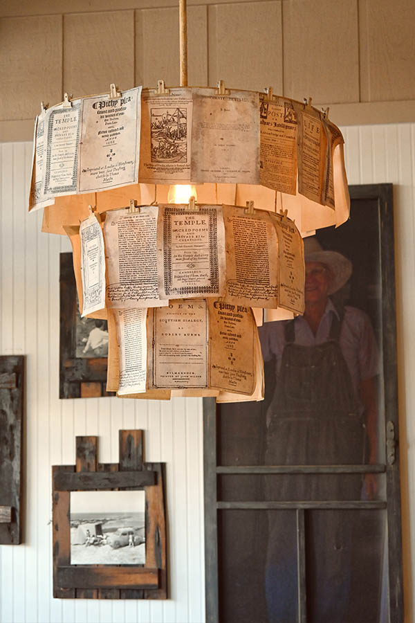 multi-tiered-chandelier-made-from-old-book-pages-or-paper-sheets-with-printed-text-that-are-held-onto-the-frame-with-clothespins
