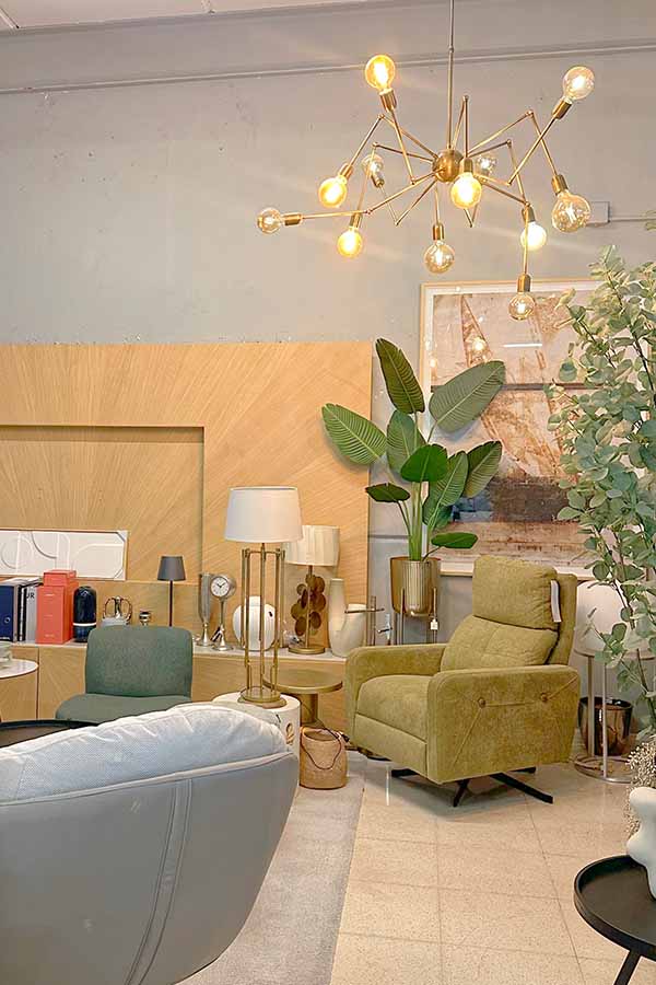 Contemporary-interior-showroom-displaying-a-modern-olive-green-upholstered-armchair