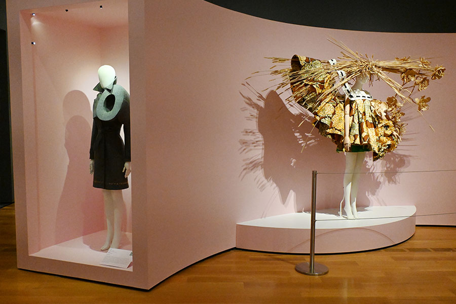 avant-garde-grey-trench-coat-and-sculptural-straw-wheat-ensemble-display