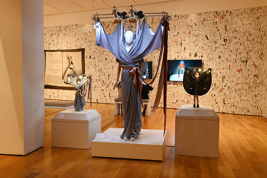 draped-performance-art-garment-with-lighting-rig-and-miniature-fashion-dolls