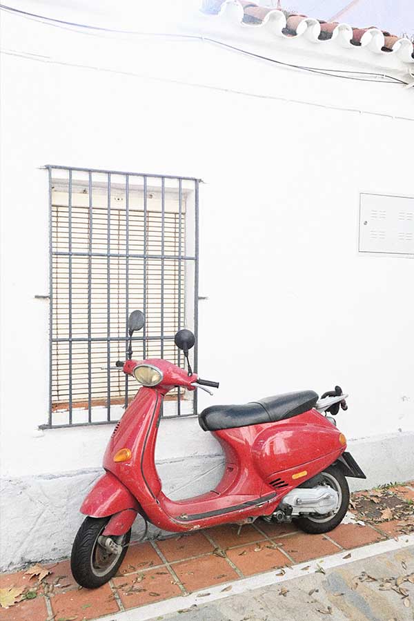 red-scooter-on-street-marbella-spain