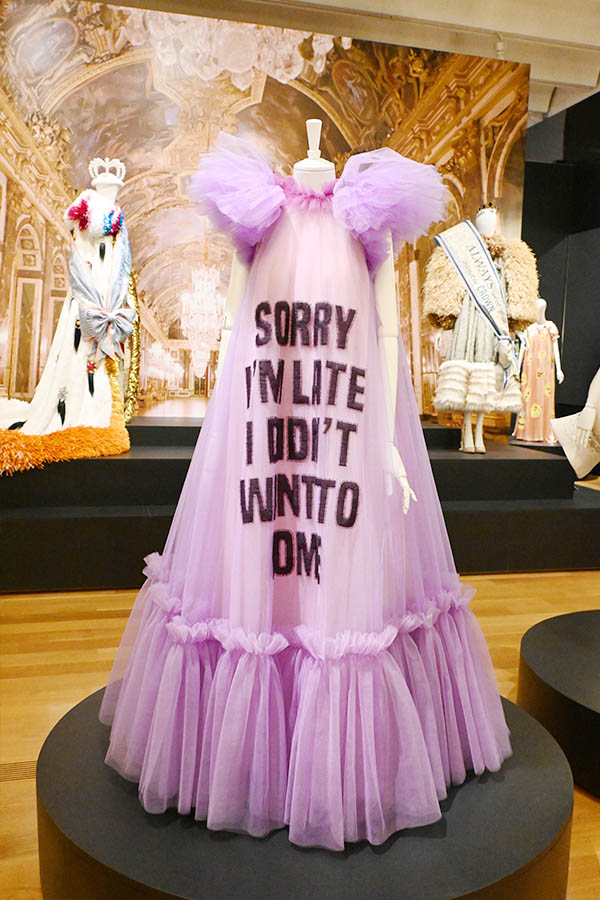 trapeze-lavender-tulle-gown-with-sorry-im-late-slogan-and-voluminous-ruffled-shoulders-viktor-and-rolf
