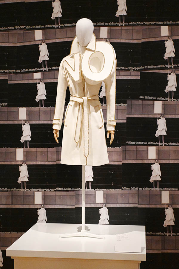 white-belted-trench-coat-with-sculptural-no-lapels-and-gold-beaded-trim