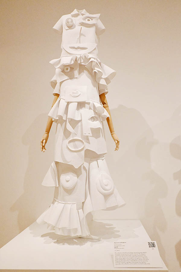 white-sculptural-couture-dress-with-cubist-facial-features-and-layered-ruffles