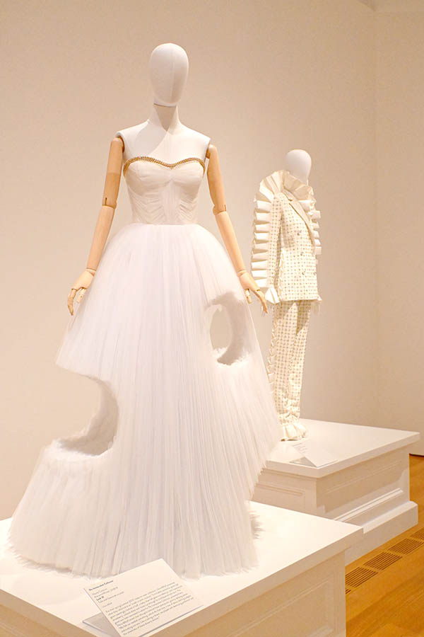 white-tulle-ball-gown-with-large-asymmetrical-cut-out-sections-and-gold-beaded-bodice