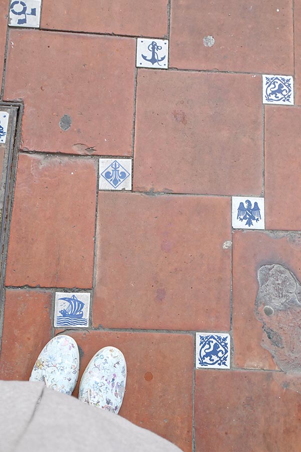 floor-tiles-accented-with-small-blue-and-white-decorative-tiles
