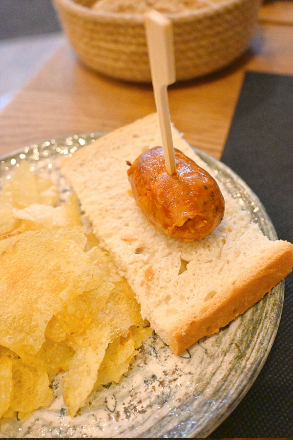 grilled-chorizo-sausage-slice-bread-potato-chips-tapa-skewered-snack-spanish-cuisine