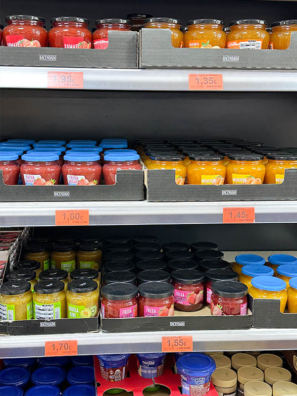 Supermarket-shelves-stocked-with-various-bottled-sauces