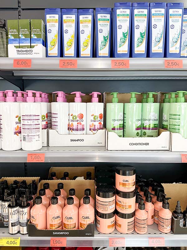 shelves-stocked-with-various-hair-care-products-including-shampoos