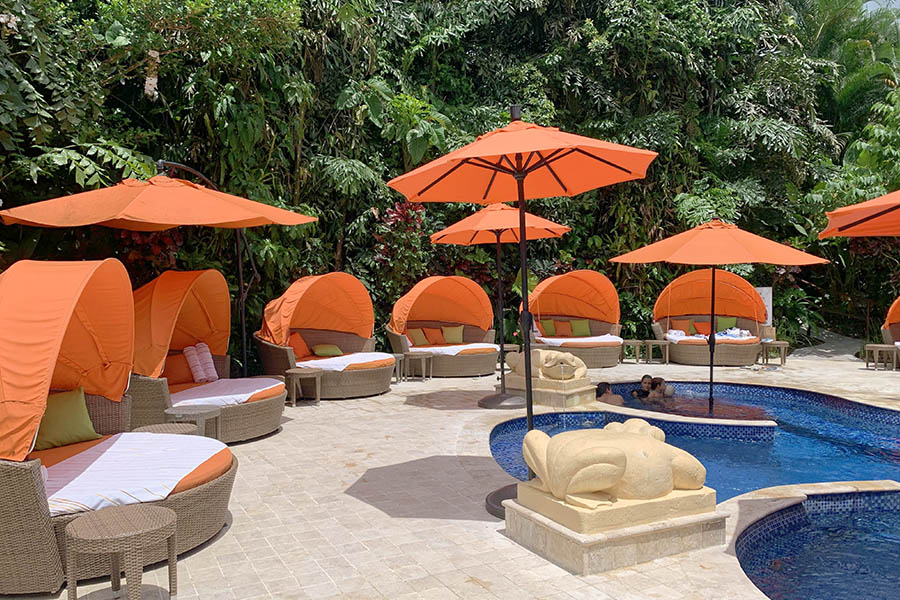 Orange-umbrellas-and-cabanas-by-a-pool-in-Costa-Rica