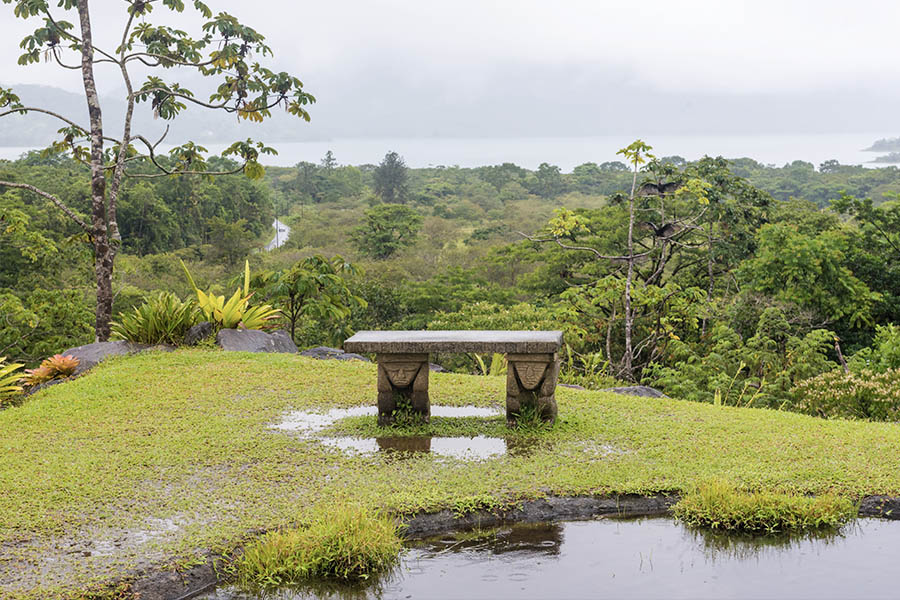 Stone-bench-overlooking-a-misty-lake-in-Costa-Rica