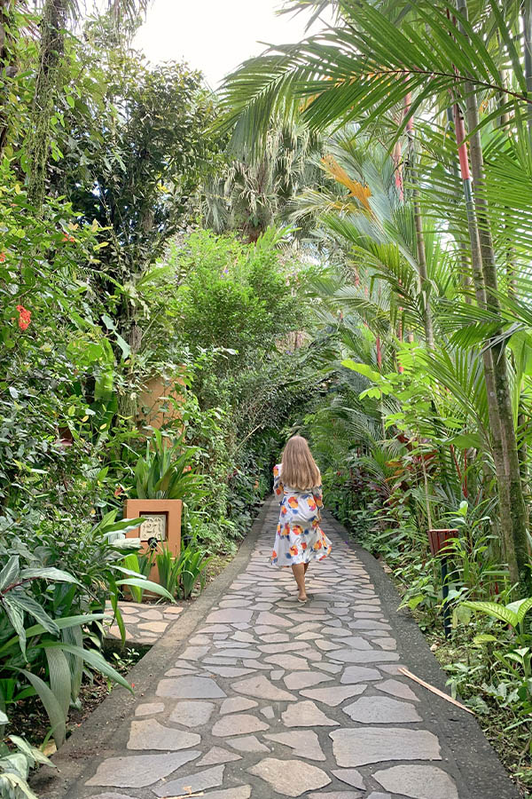 Woman-walking-scenic-botanical-trail-Costa-Rica-pathway
