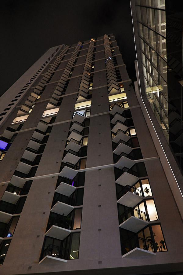 dramatic-night-perspective-of-zigzagging-balconies-on-a-high-rise-building-illustrating-bold-Miami-Architecture