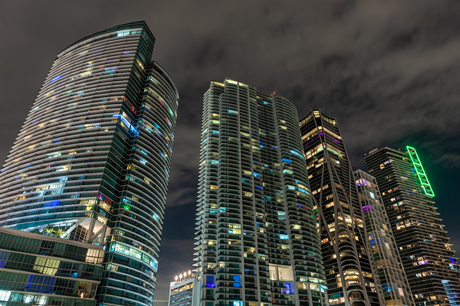 sleek-high-rise-miami-architecture-dusk-city-lights-modern-living