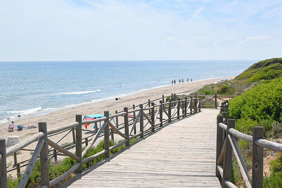 Wooden-boardwalk-leads-to-sandy-shore-Spain-beaches-Playa-Cabopino