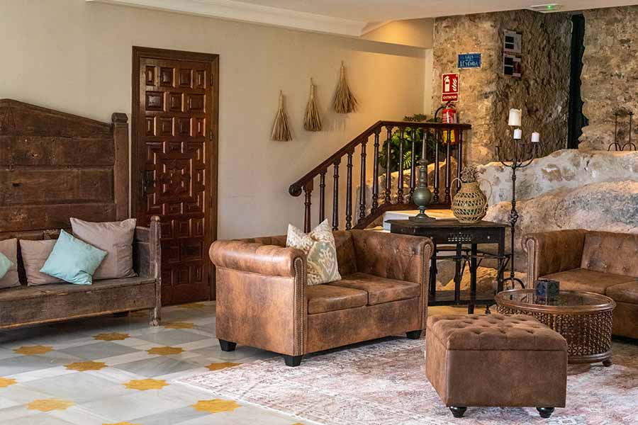 cosy-lobby-lounge-with-leather-sofas-and-stone-walls-at-hotel-castillo-de-monda-spain