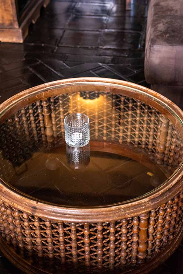 round-wooden-spindle-coffee-table-with-glass-top-offering-interior-design-inspiration