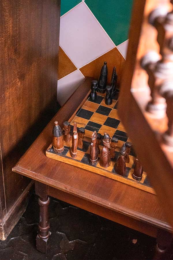 rustic-hand-carved-wooden-chess-set-on-side-table-providing-interior-design-inspiration
