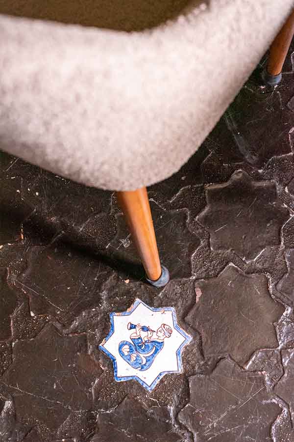 unique-star-shaped-floor-tiles-with-hand-painted-musician-detail-at-hotel-castillo-de-monda-spain