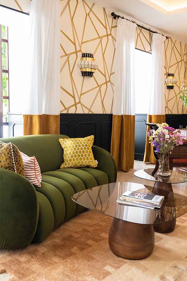 Lounge-green-channel-tufted-sofa-gold-geometric-wallpaper-hotel-claude-marbella-spain-interior-design-boutique-hotel-design
