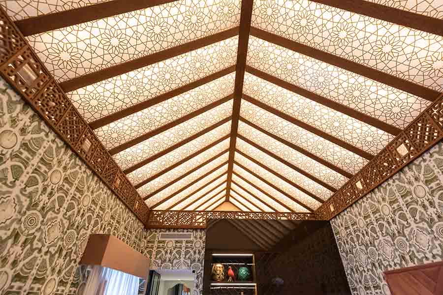 Vaulted-geometric-patterned-ceiling-wooden-beams-wallpapered-walls-hotel-claude-marbella-spain-interior-design-boutique-hotel-design