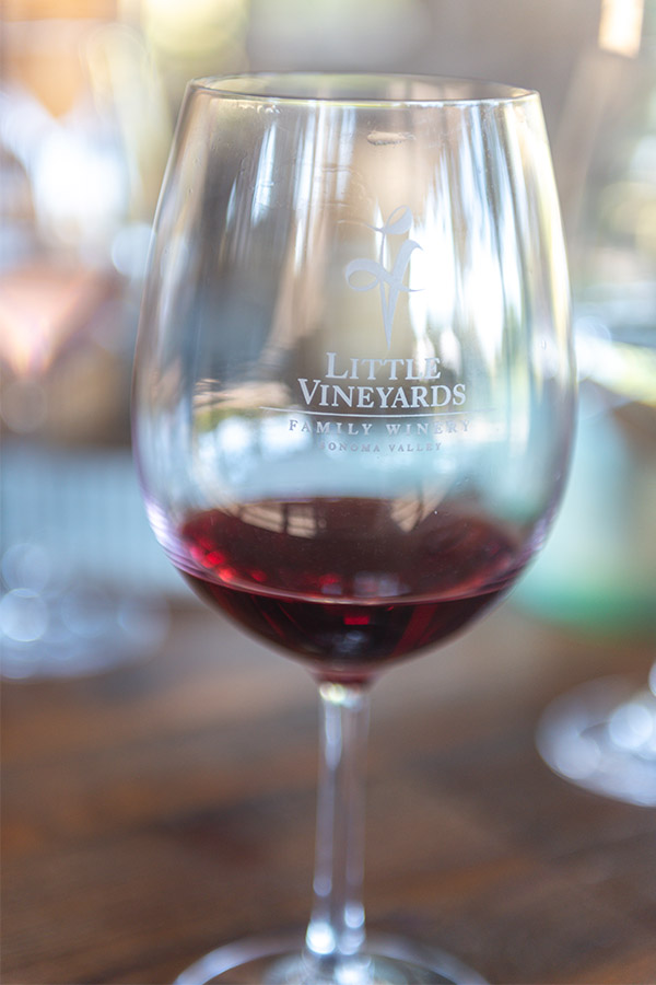 close-up-of-a-glass-of-red-wine-with-logo-little-vineyards-family-winery-sonoma-valley-california