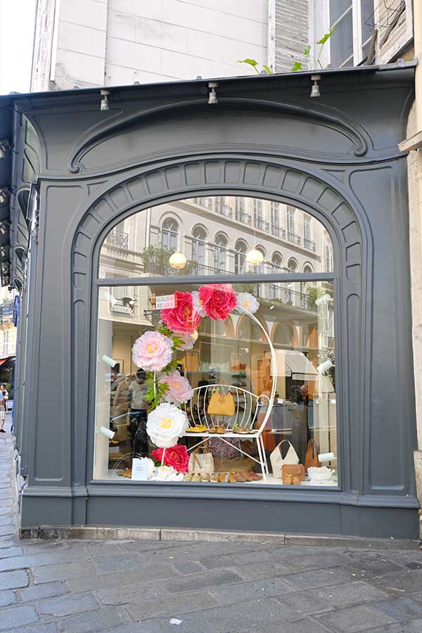 paris-france-charming-boutique-window-display-decorated-with-large-paper-peonies