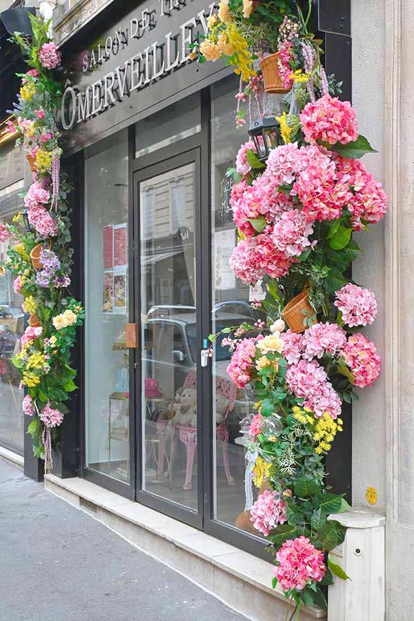 paris-france-flower-shop-entrance-adorned-with-vibrant-pink-hydrangeas-and-floral-garlands