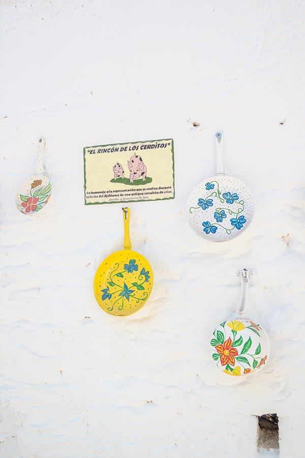 decorative-painted-frying-pans-whitewashed-wall-Almachar-Spain-white-villages-Andalusia
