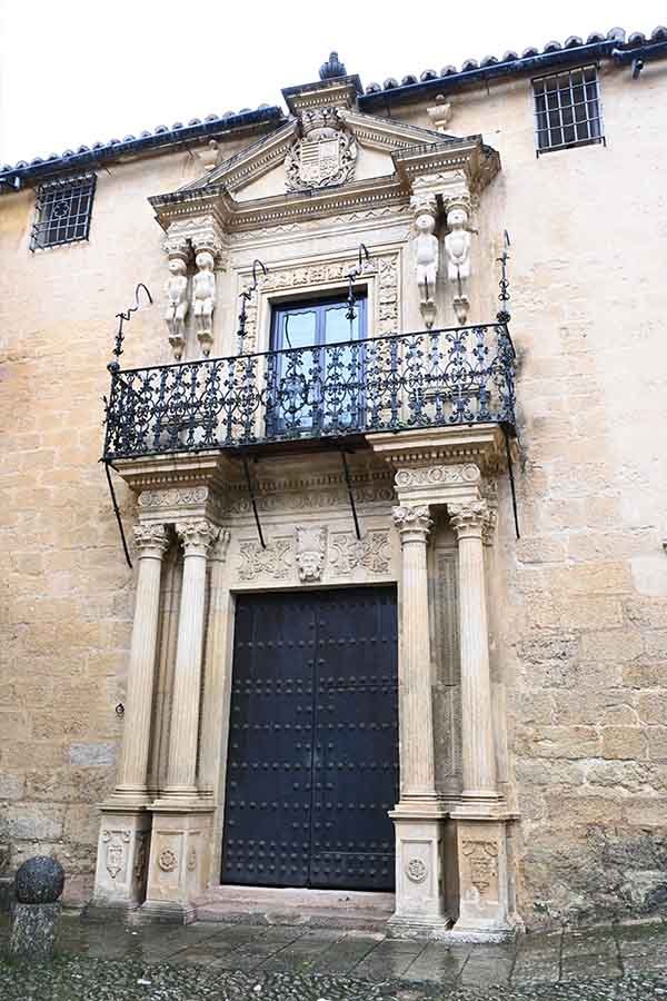 grand-historic-building-facade-with-ornate-balcony-and-columns-showcasing-vintage-travel