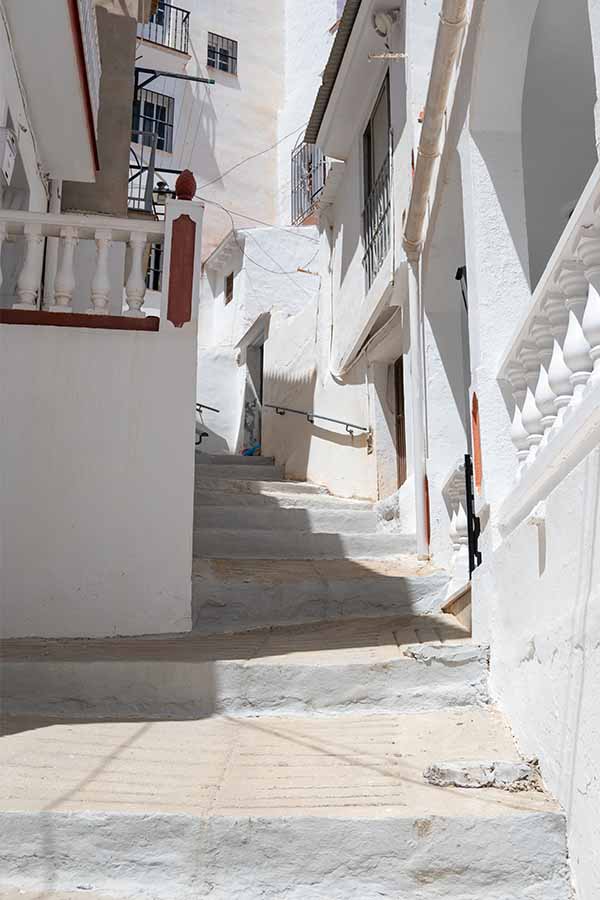 narrow-stepped-street-whitewashed-houses-Almachar-Spain-white-villages-Andalusia