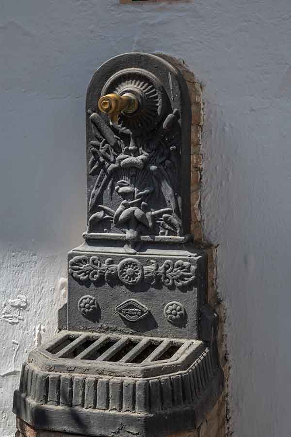 ornate-black-cast-iron-water-fountain-Almachar-Spain-white-villages-Andalusia
