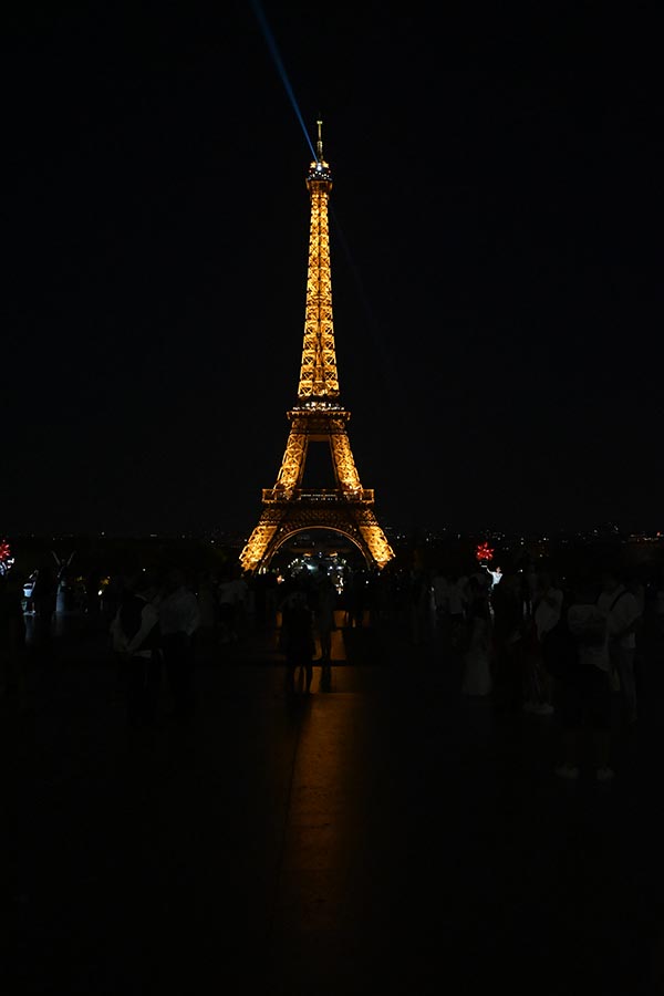 paris-at-night-illuminated-eiffel-tower-shining-brightly-against-the-dark-sky