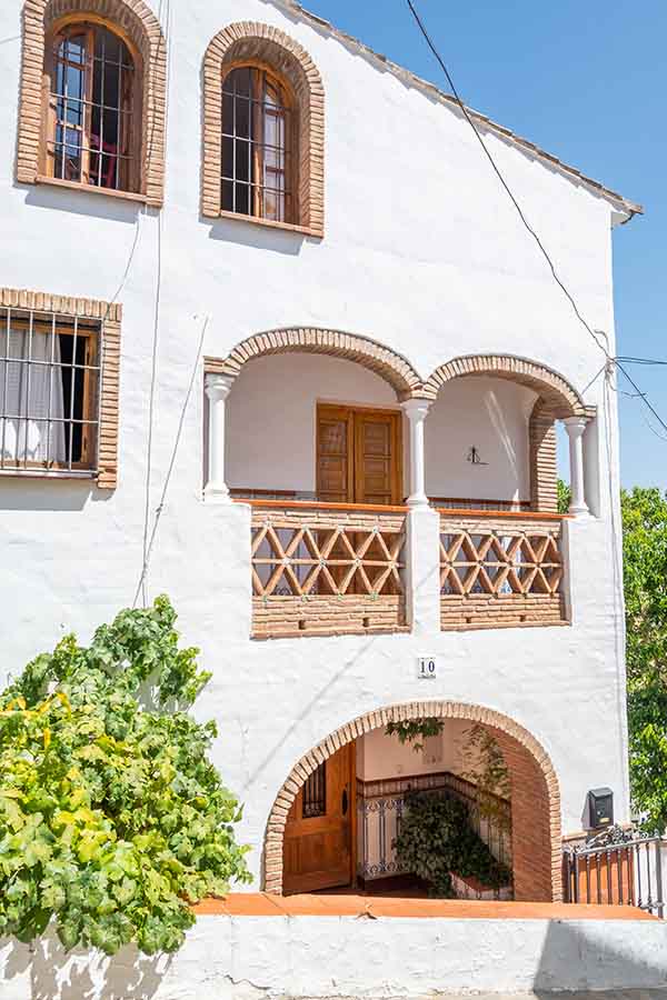 traditional-white-house-brick-arches-balcony-Almachar-Spain-white-villages-Andalusia